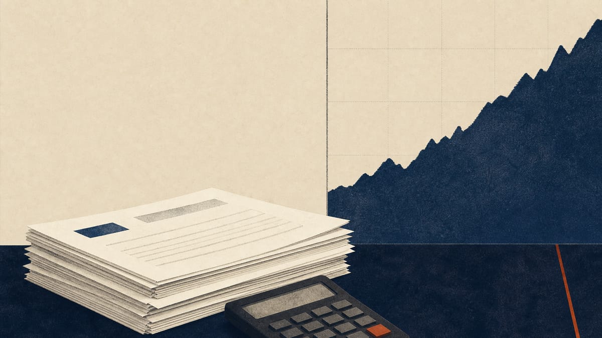 Printed shareholding reports and a calculator on a desk beside a market screen in an office.