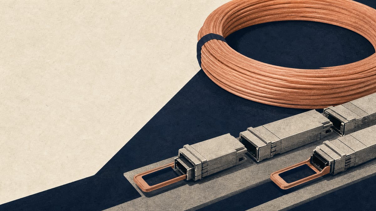 Coils of fiber-optic cable and optical transceiver modules on an industrial production line.