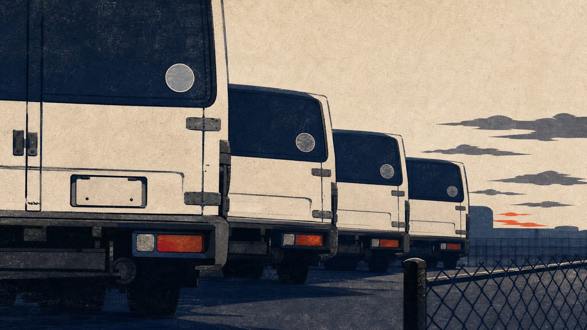 Used cargo trucks in a storage yard with focus on vehicle registration plates, one left blank to represent an unresolved title transfer.